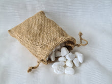 Load image into Gallery viewer, Decorative white stones in a drawstring gunny bag.
